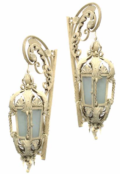 Appraisal: A pair of wrought iron and tole paint decorated lanterns