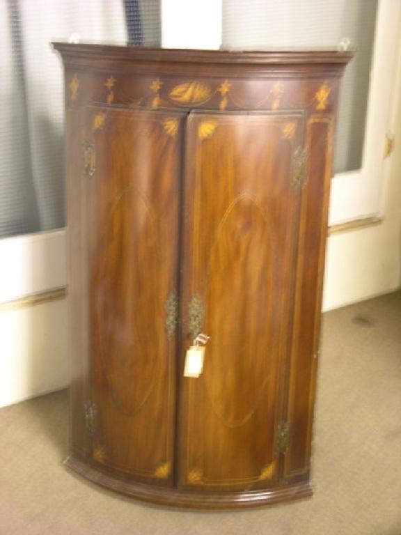 Appraisal: A George III inlaid mahogany bow front corner cupboard inlaid