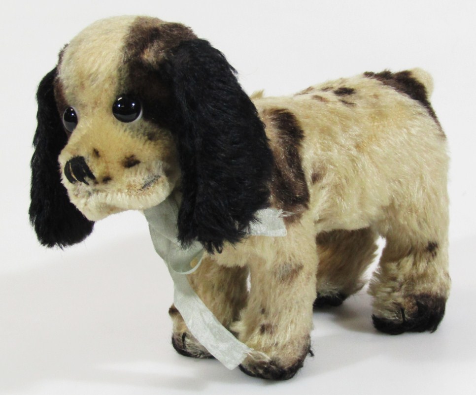 Appraisal: A thC plush jointed dog in the manner of Steiff