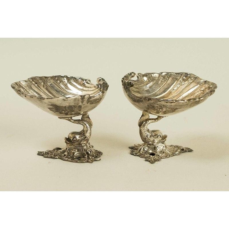 Appraisal: Two Nut Dishes Pair of dolphin footed clamshell nut dishes