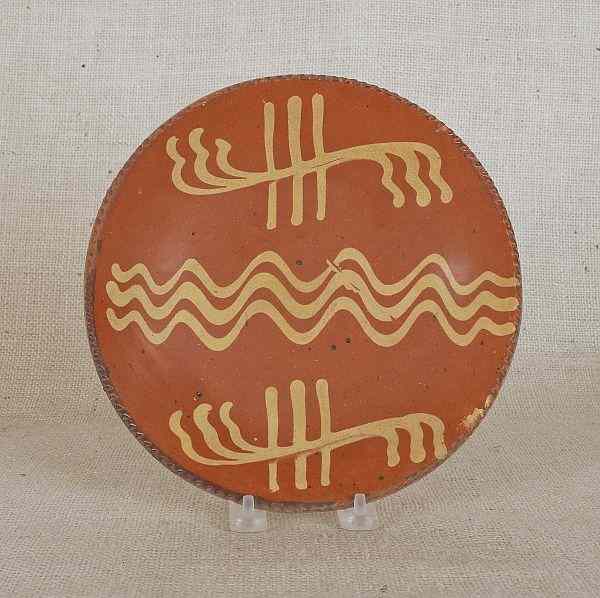 Appraisal: Pennsylvania redware pie plate th c with yellow slip decoration