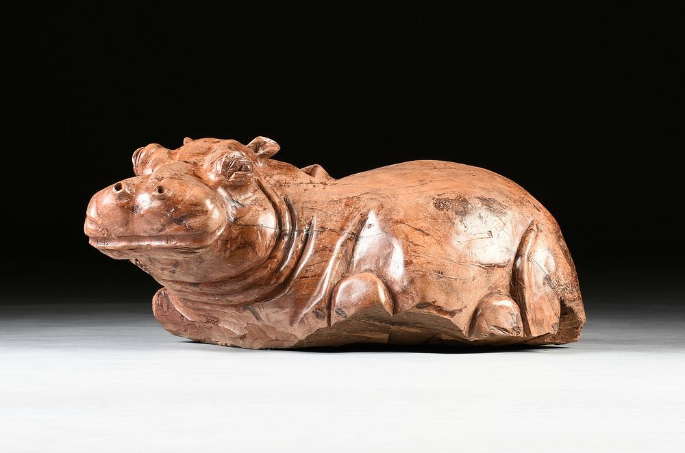 Appraisal: A CARVED TEAK BABY HIPPOPOTAMUS MID LATE TH CENTURY A