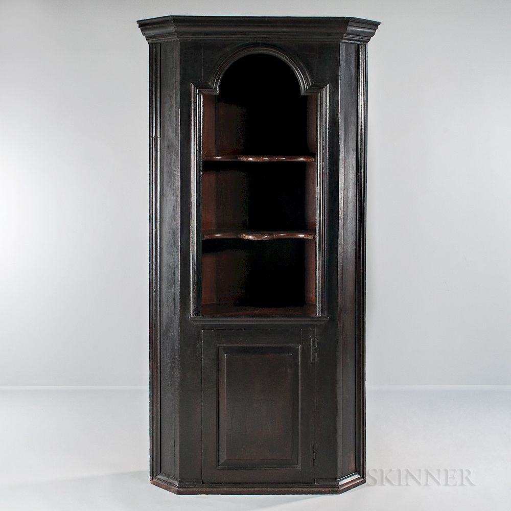 Appraisal: Small Early Black-painted One-piece Corner Cupboard Small Early Black-painted One-piece