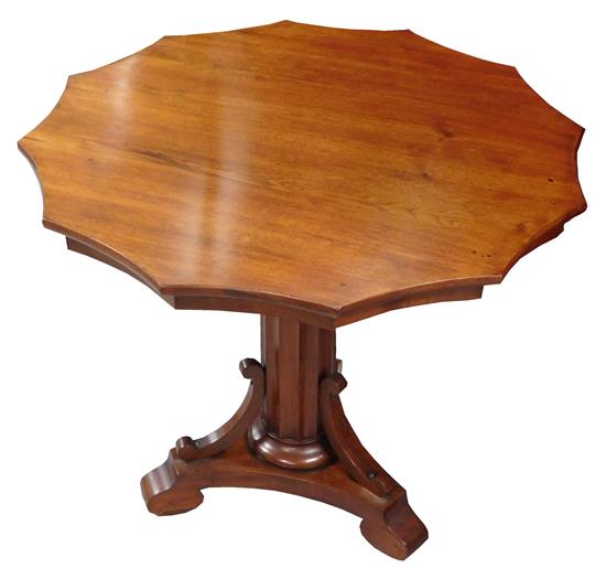 Appraisal: Mahogany center hall table round top with scalloped edges fluted