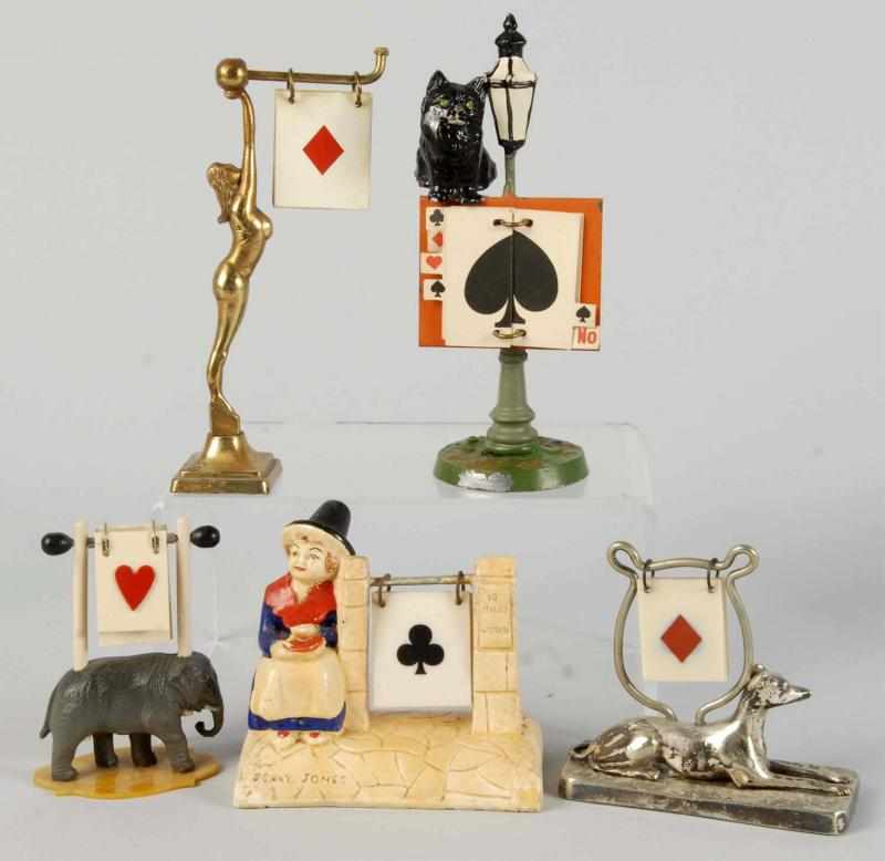 Appraisal: Lot of Figural Trump Indicators Description Includes one cat on