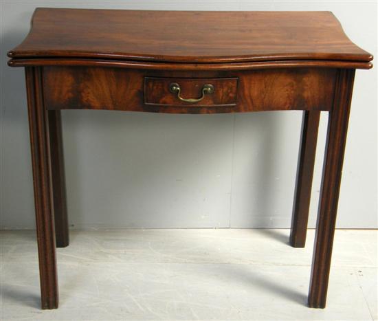 Appraisal: George III serpentine mahogany tea table with folding top single