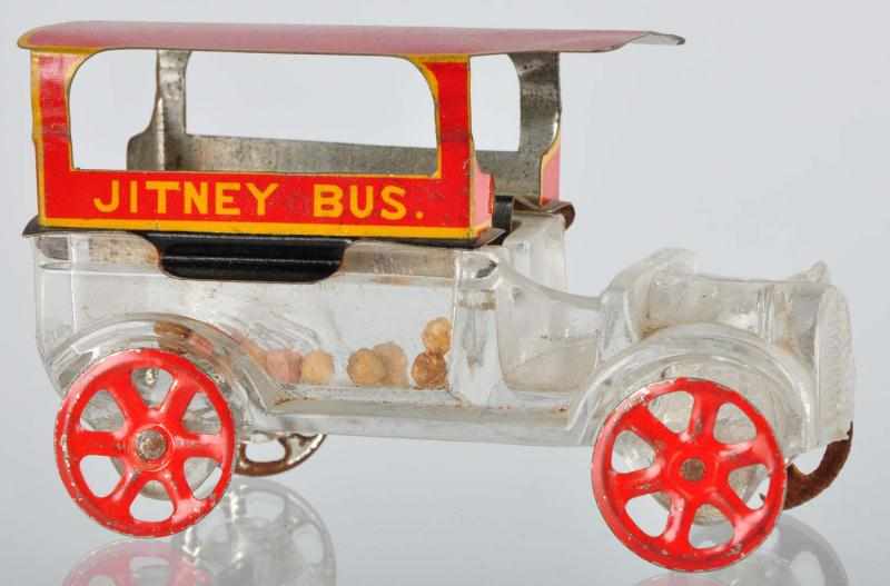 Appraisal: Glass Jitney Bus Candy Container Description Original top and wheels