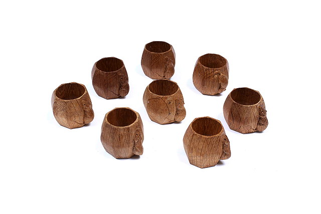 Appraisal: A SET OF EIGHT MOUSEMAN OCTAGONAL CARVED OAK NAPKIN RINGS