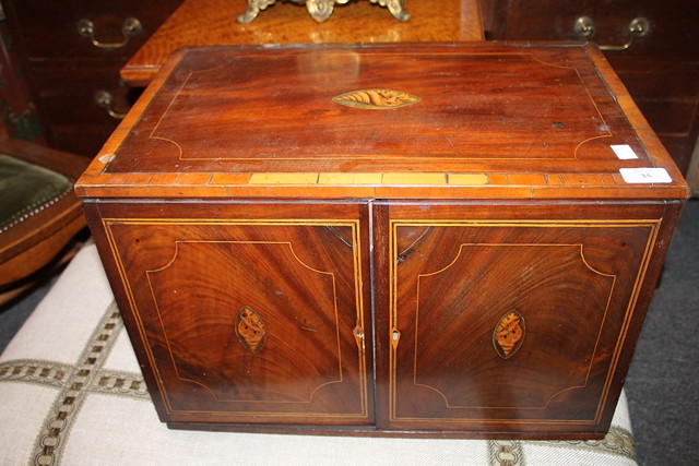 Appraisal: A TH CENTURY MAHOGANY COLLECTOR'S CABINET with conch shell and