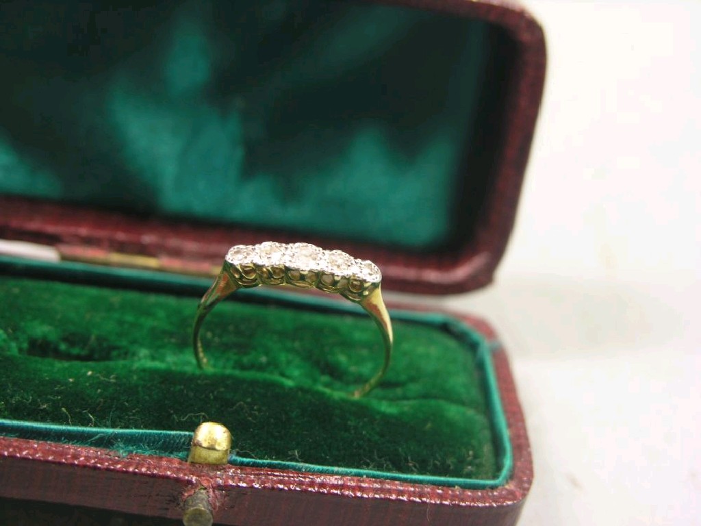 Appraisal: A gold and five-stone diamond ring claw setting ring size