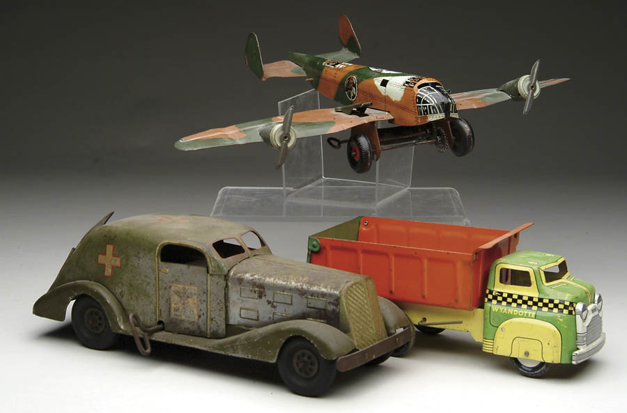 Appraisal: LOT OF THREE TIN TOYS Includes a Marx army airplane