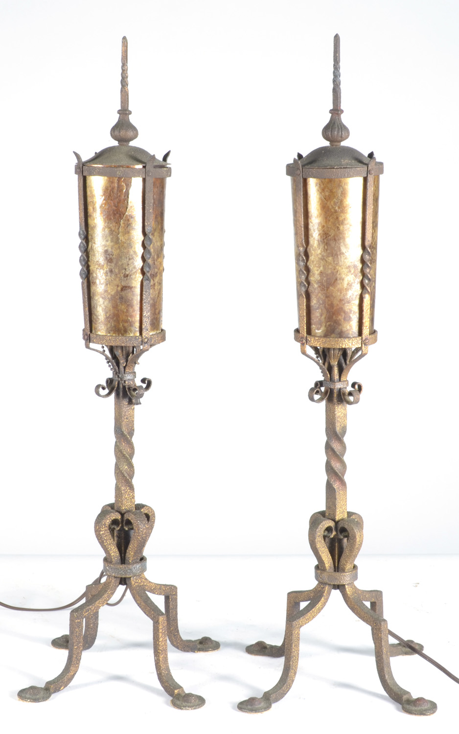 Appraisal: PAIR OF WROUGHT IRON AND MICA DECORATIVE LAMPS in Moorish