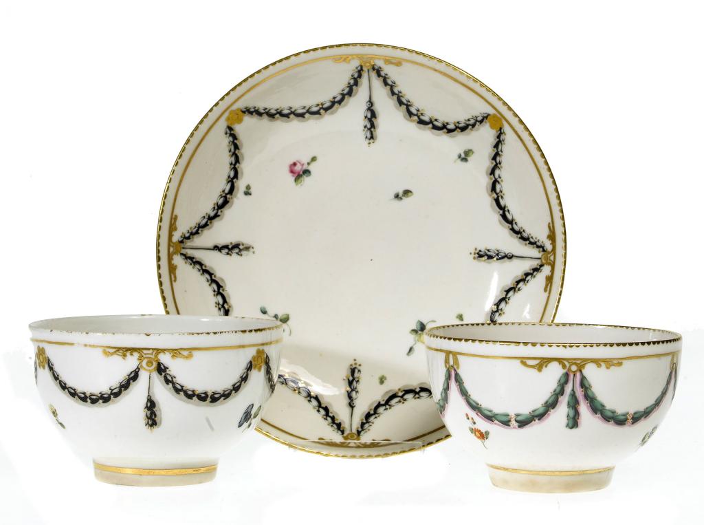 Appraisal: A DERBY TEA BOWL AND SAUCER enamelled with scattered sprigs