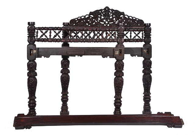 Appraisal: AN INDO-PORTUGUESE GOAN CARVED HARDWOOD BED with pierced and carved