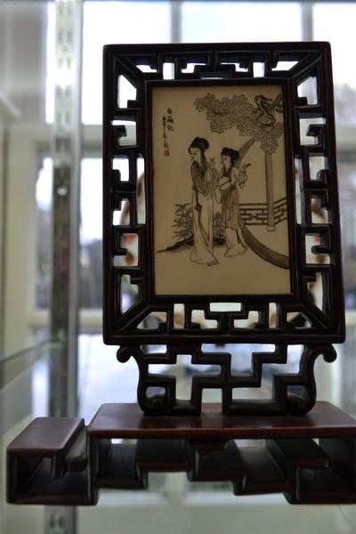 Appraisal: ETCHED IVORY PANEL IN TIMBER FRAME GEISHA SCENES