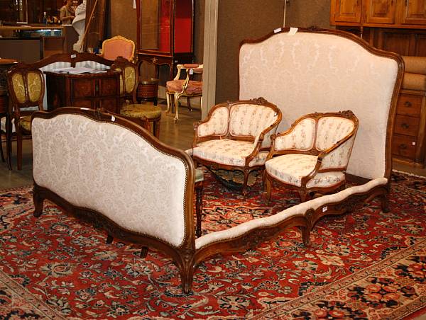 Appraisal: A Louis XV style walnut and upholstered bed th century