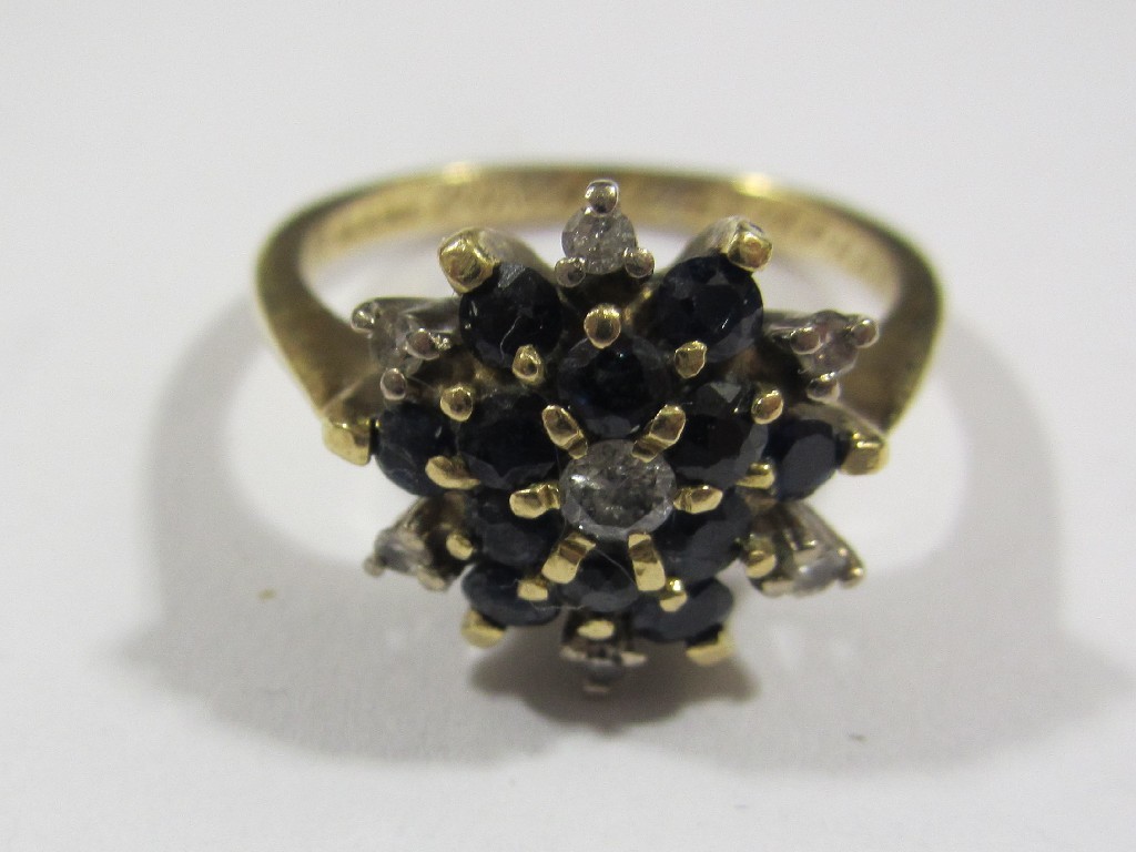 Appraisal: Eighteen carat gold sapphire and diamond cluster ring