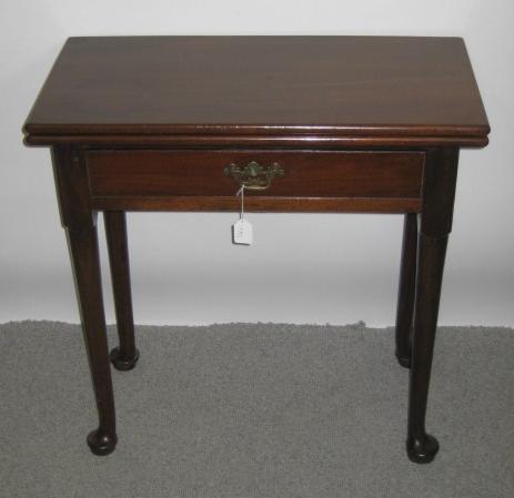 Appraisal: A SMALL EARLY GEORGE III MAHOGANY FOLDING TABLE of oblong