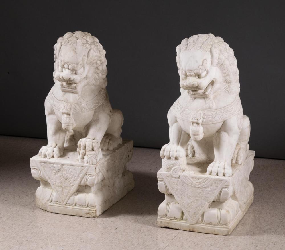 Appraisal: PAIR OF CHINESE WHITE MARBLE FOO LIONS male female in