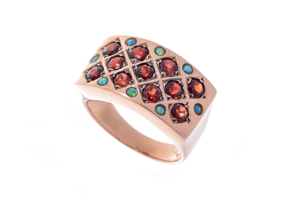 Appraisal: GARNET OPAL RING K yellow gold ring with round faceted