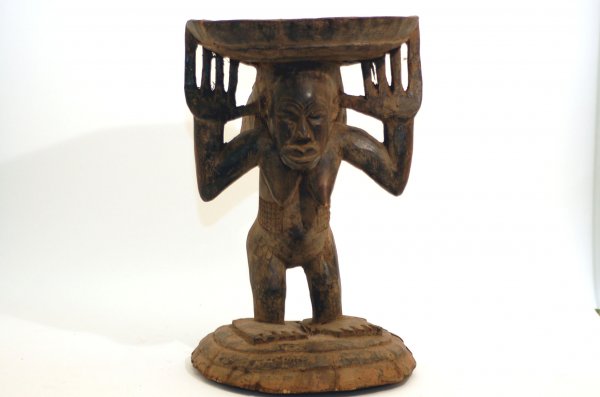 Appraisal: Luba anthropomorphic caryatid stool having a round stepped base surmounted