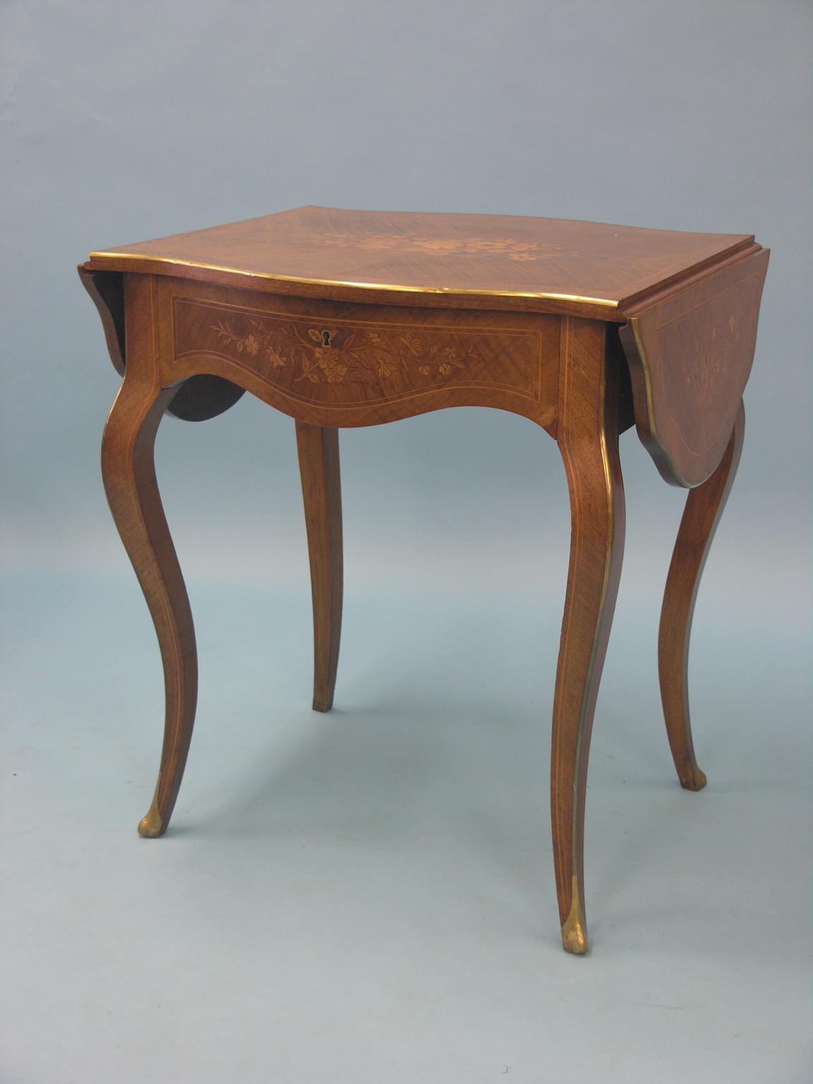 Appraisal: A Louis XV-style mahogany and floral marquetry side table serpentine-shape