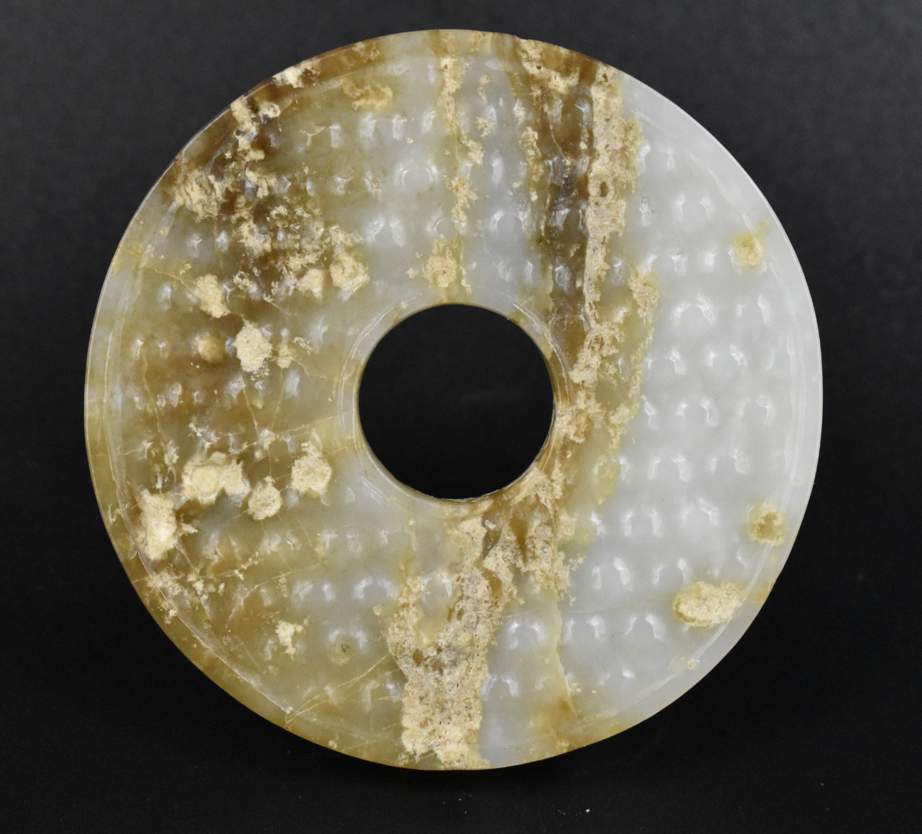 Appraisal: A jade carved disc pendant dating from the Han dynasty