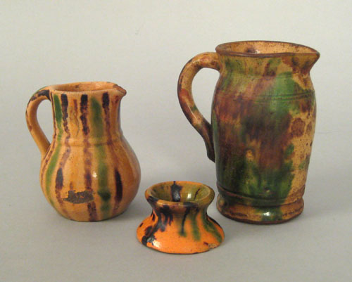 Appraisal: Shenandoah Valley redware pitcher th c together with another pitcher