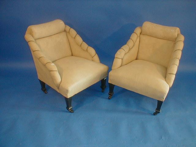 Appraisal: A pair of Victorian aesthetic upholstered chairs with square taper