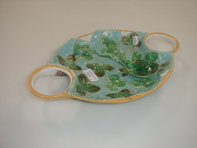 Appraisal: A George Jones Majolica strawberry dish and spoon damaged and