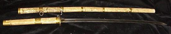 Appraisal: Japanese sword with carved bone sheath looseness at joints repair