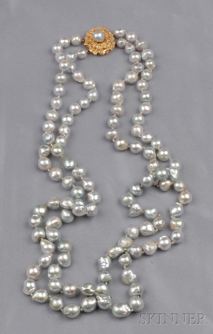 Appraisal: Baroque Pearl Necklace the double strand composed of silver-tone baroque