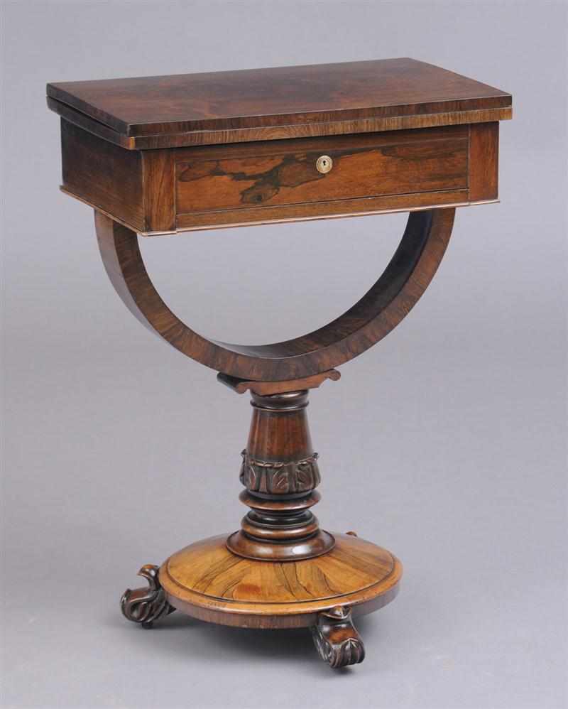 Appraisal: REGENCY CARVED ROSEWOOD SEWING TABLE The rectangular folding and swivel