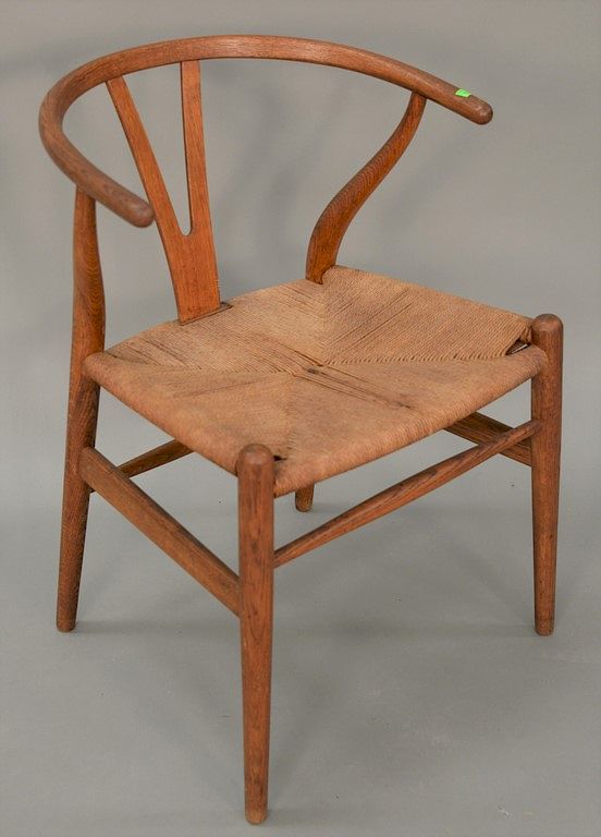 Appraisal: Hans Wegner Wishbone arm chair having a rush seat Hans