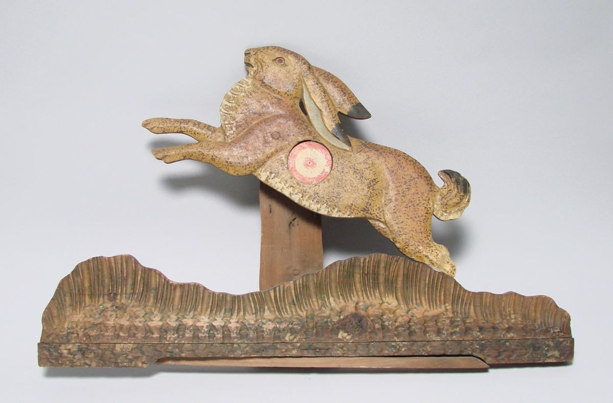 Appraisal: CARVED AND PAINTED WOODEN RABBIT-FORM CORK RIFLE TARGET Height Length