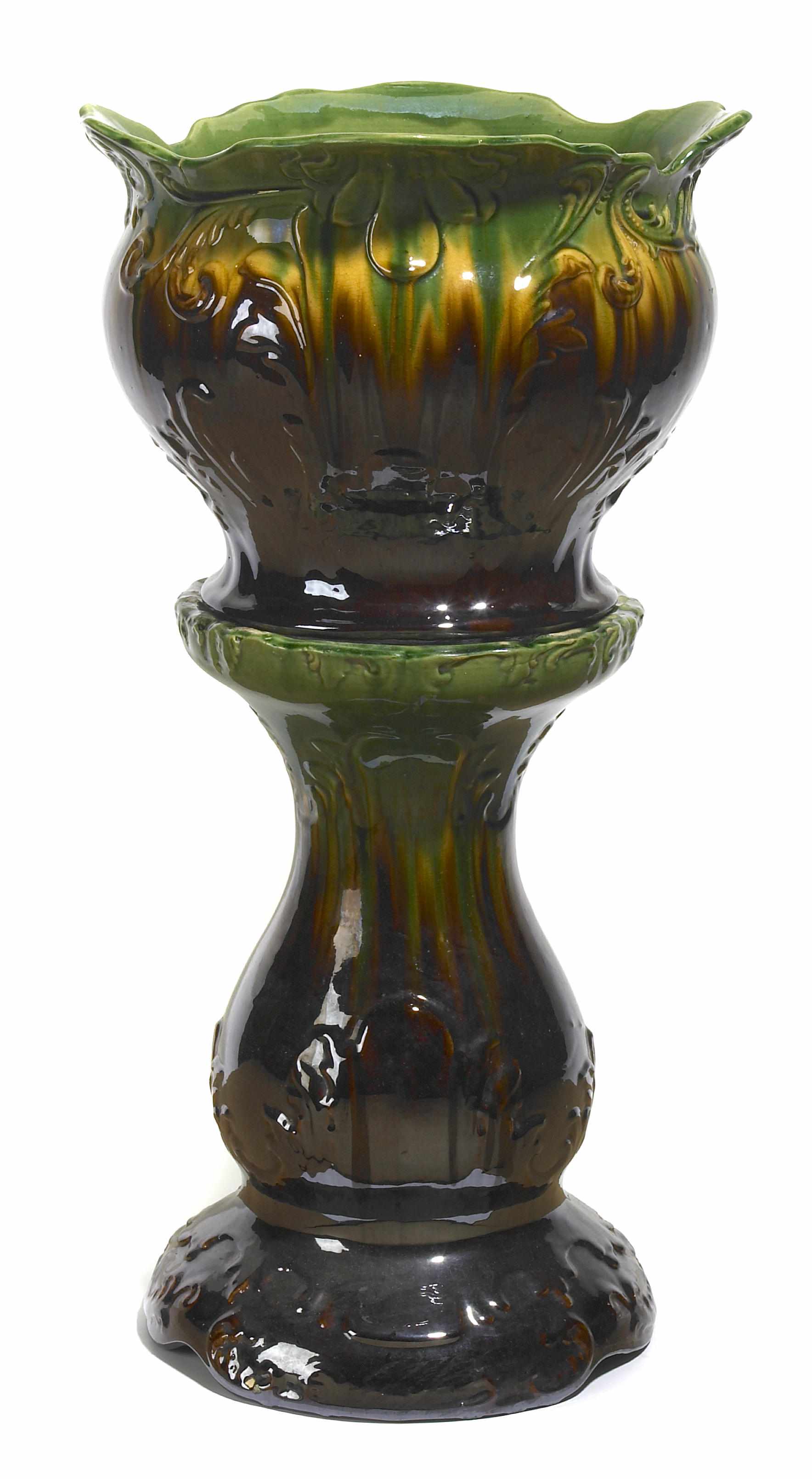 Appraisal: A Continental glazed earthenware jardinire on pedestal late th century