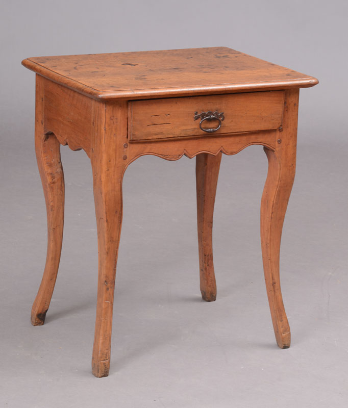 Appraisal: LOUIS XV PROVINCIAL FRUITWOOD SIDE TABLE The overhanging top above