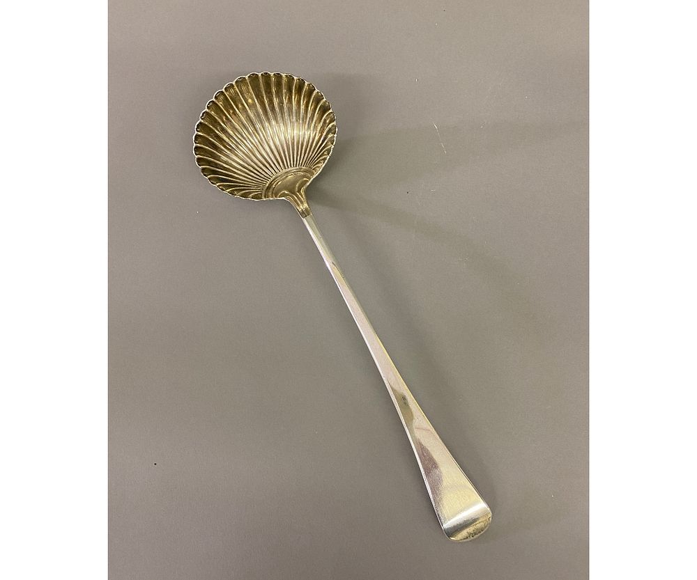 Appraisal: Georgian Silver Ladle Georgian silver ladle hallmarked with scalloped shell