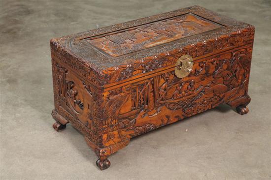 Appraisal: CARVED ORIENTAL STYLE TRUNK Camphor with elaborately carved village and