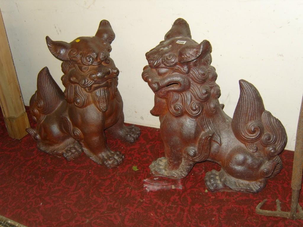 Appraisal: A pair of salt glazed terracotta garden ornaments in the