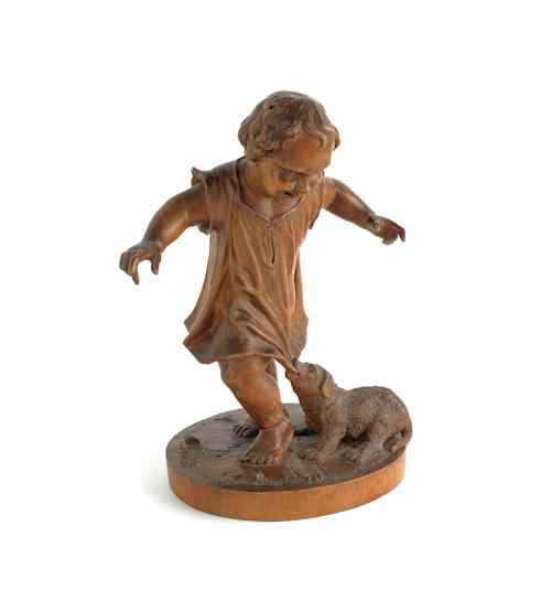 Appraisal: Swiss carved figure of a young boy and his dog