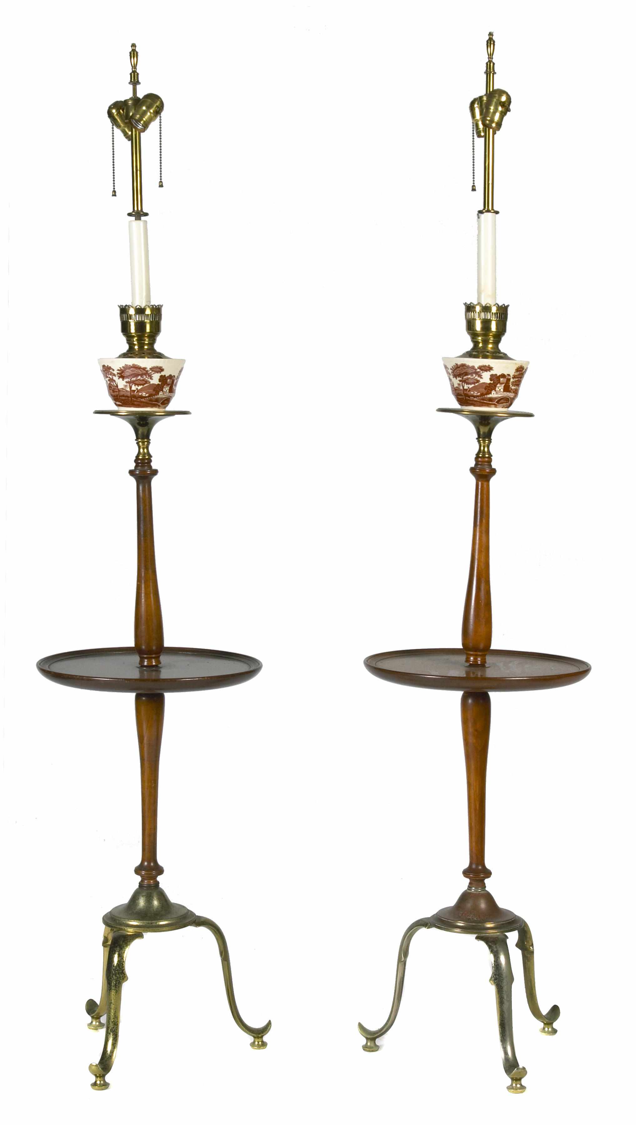 Appraisal: A pair of Victorian brass and mahogany standing floor lamps