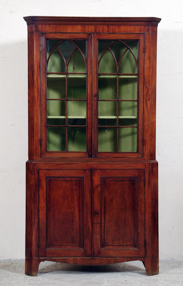 Appraisal: A GEORGE III MAHOGANY STANDING CORNER CUPBOARD the moulded cornice