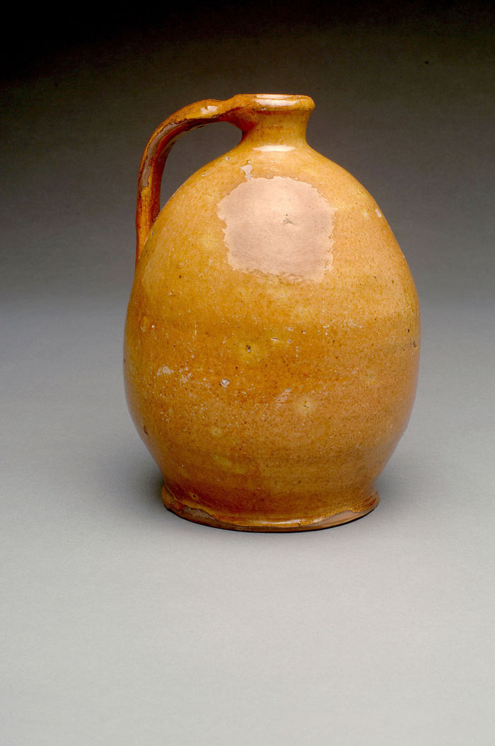 Appraisal: AMERICAN GLAZED REDWARE JUG NEW ENGLAND CIRCA Of ovoid form