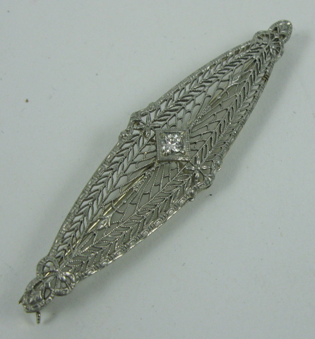 Appraisal: DIAMOND AND FOURTEEN KARAT WHITE GOLD BROOCH set with a