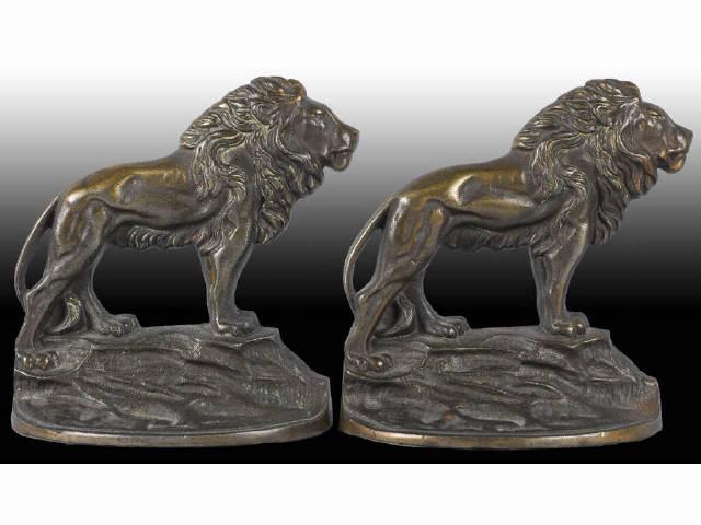 Appraisal: Lion Cast Iron Bookends Description Marked Bronze Met Copyright Gifthouse