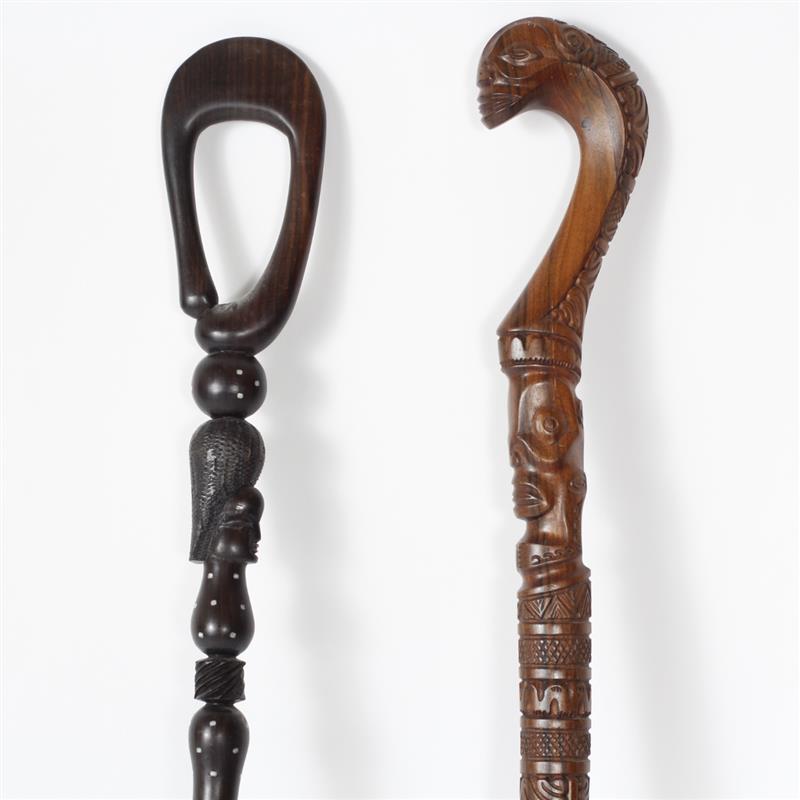 Appraisal: Two ethnographic carved wood figural walking canes Africa and Marquesas