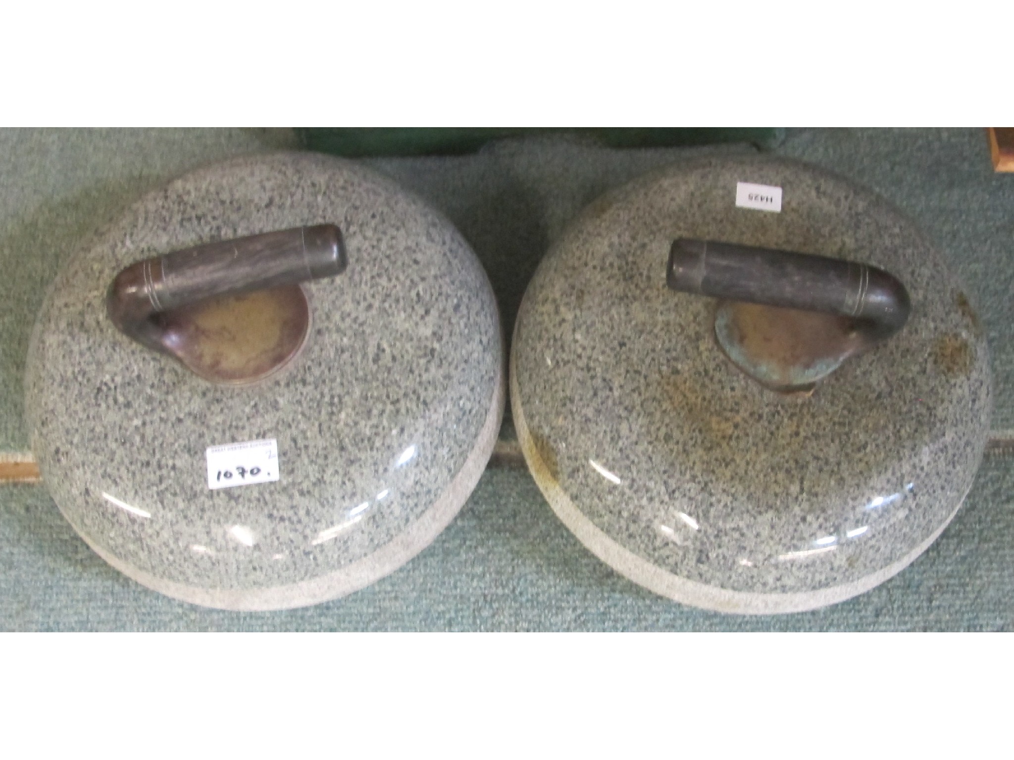 Appraisal: A pair of granite curling stones