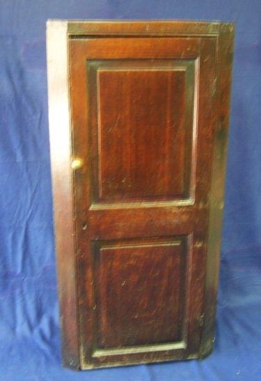 Appraisal: An th Century oak corner cupboard the door with two