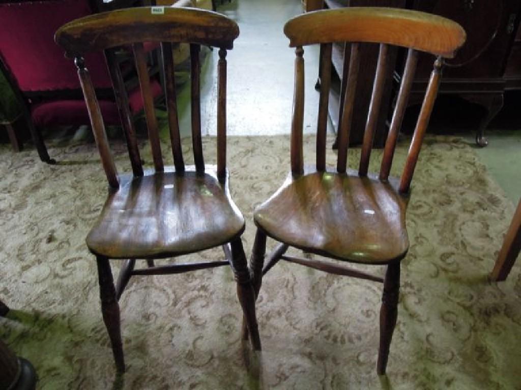 Appraisal: A pair of Victorian stained elm and beechwood chairs raised